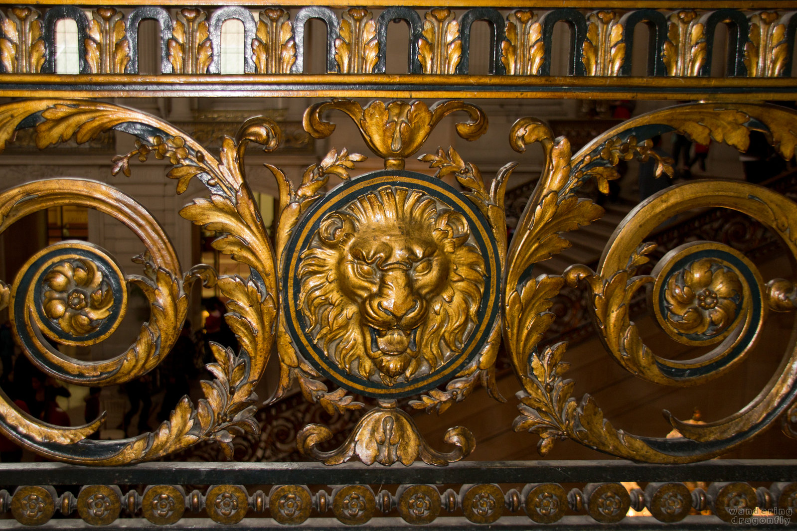 Carved parapet with lion head -- art, decoration