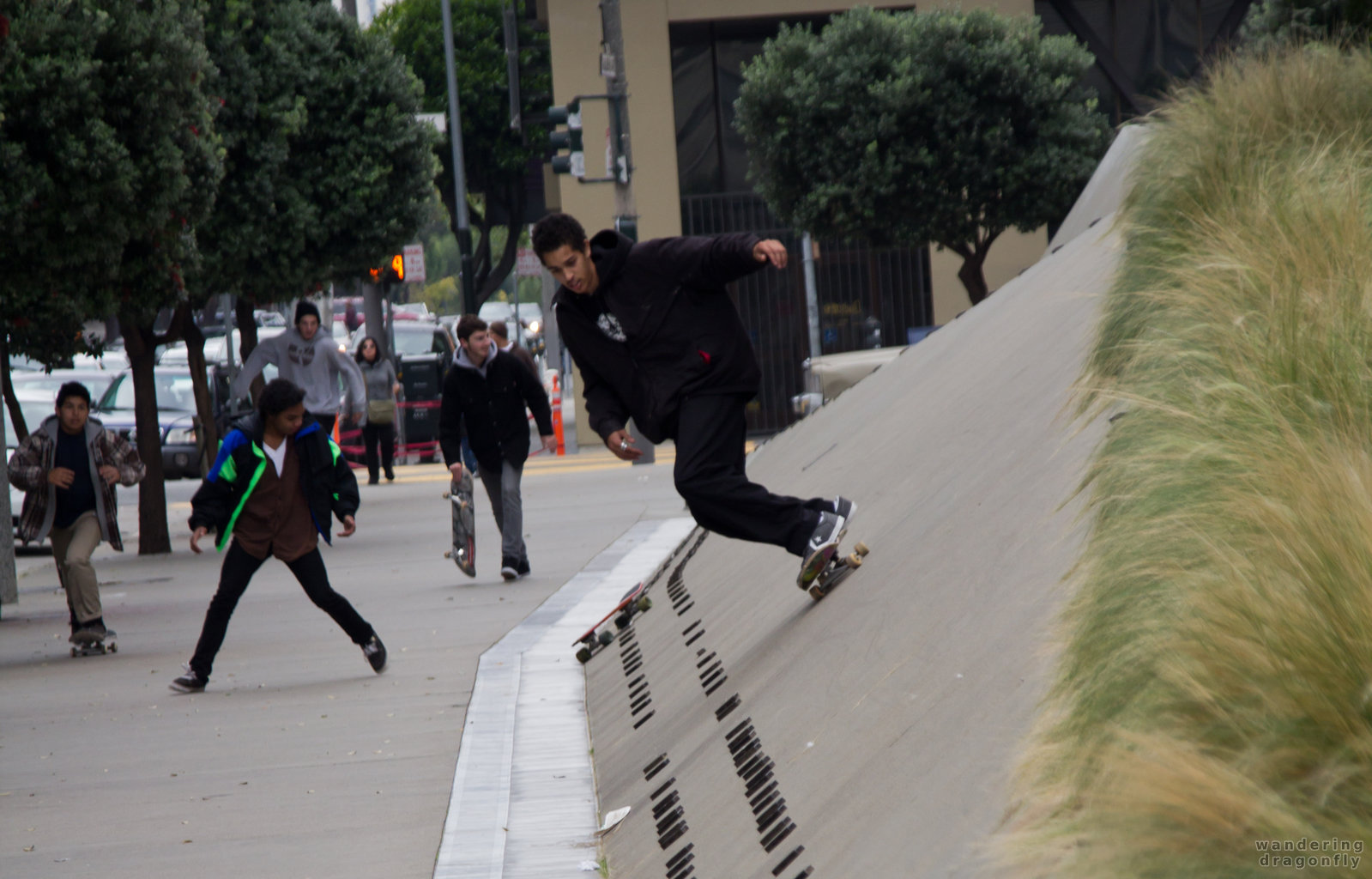 Skateboarders in front of the Phillip Burton Federal Building