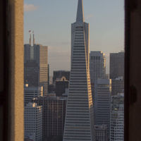 Picture of the Transamerica Pyramid through the window of Coit Tower