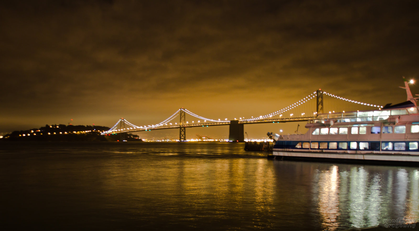 Ferry is preparing to leave -- bridge, night, ship, water